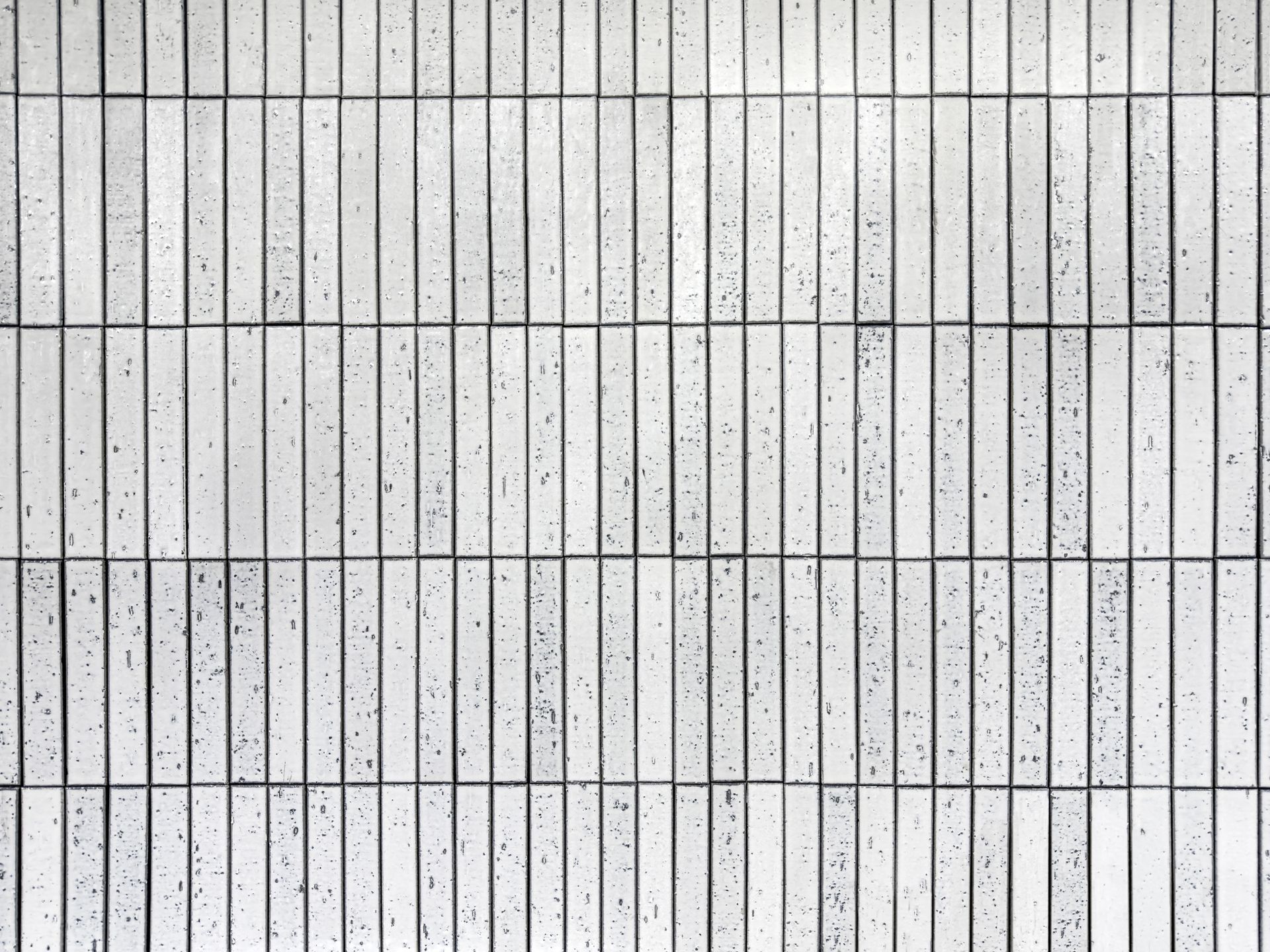 White rectangular tiled wall.