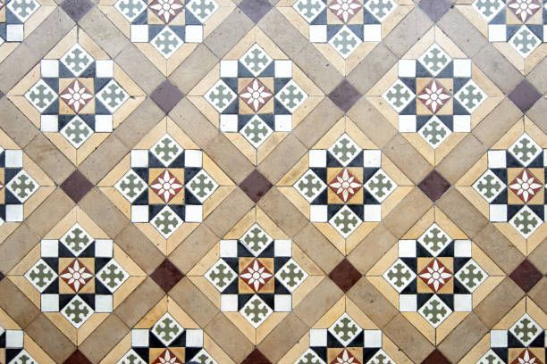 Tiled floor pattern: repeating diamond shapes with ornate floral and geometric designs in tan, brown, and green.