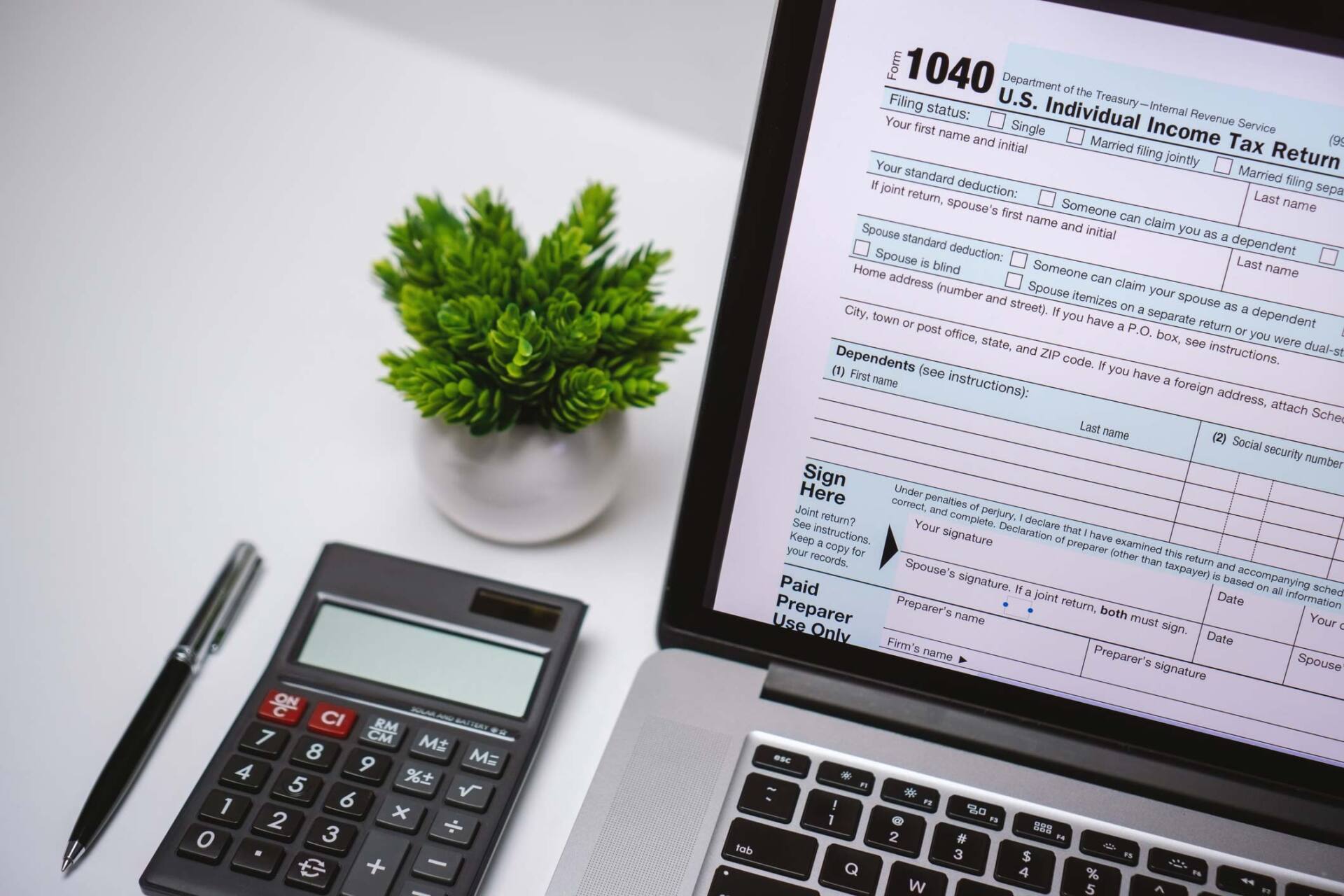 Tax Form in Laptop — Jacksonville, FL — Johnson and Johnson, P.A.