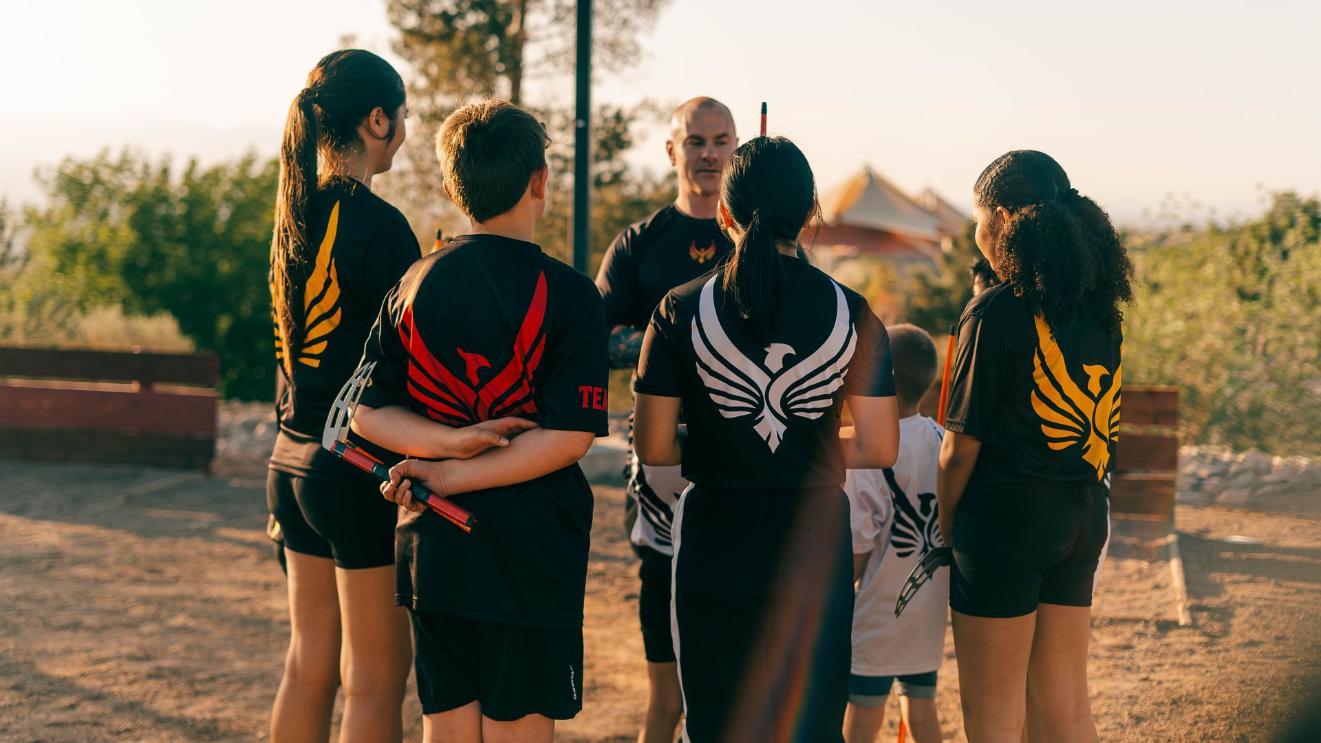 A person is holding a sparkler in their hand in the dark.