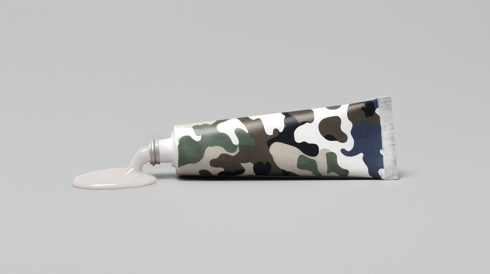 A tube of hair color with a camouflage pattern on it.