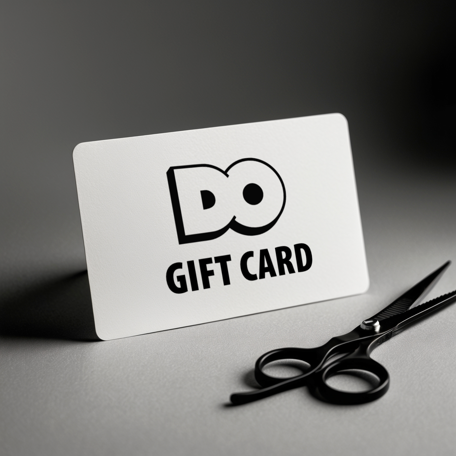 A do gift card is next to a pair of scissors