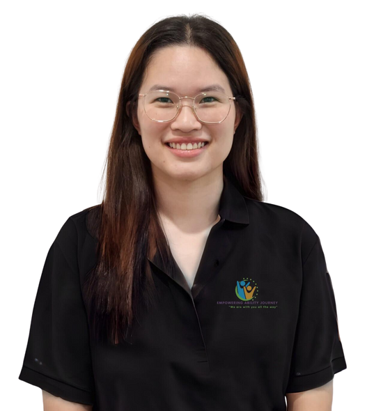 A woman wearing glasses and a black shirt is smiling.