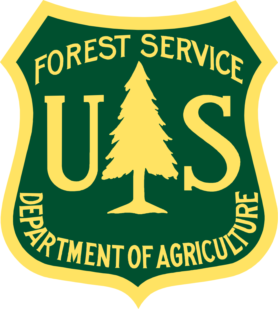 U.S. Forest Service shield logo in green, yellow, and gold with pine tree and USDA text