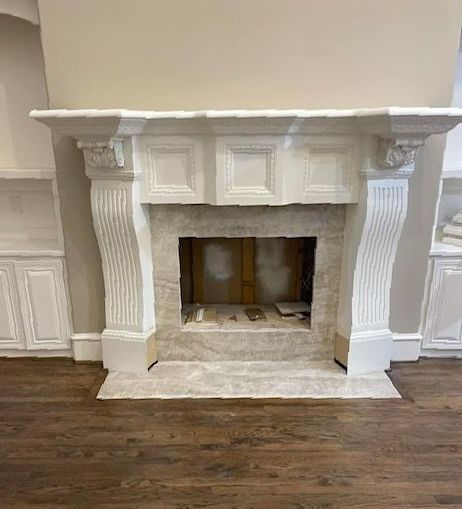 A kitchen with a sink and cabinets and a window