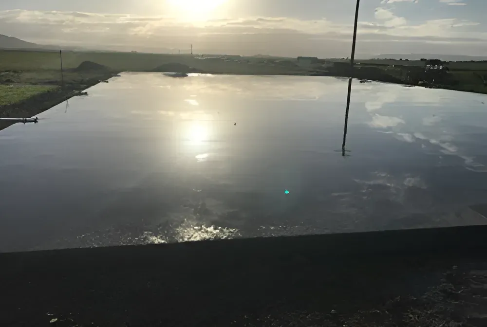 A Large Body Of Water With A Sunset In The Background — S & K Gallaway Concreting In West Mackay, QLD