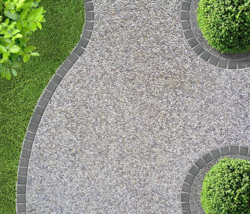 An Aerial View Of A Walkway In A Garden Surrounded By Plants And Grass — S & K Gallaway Concreting In West Mackay, QLD