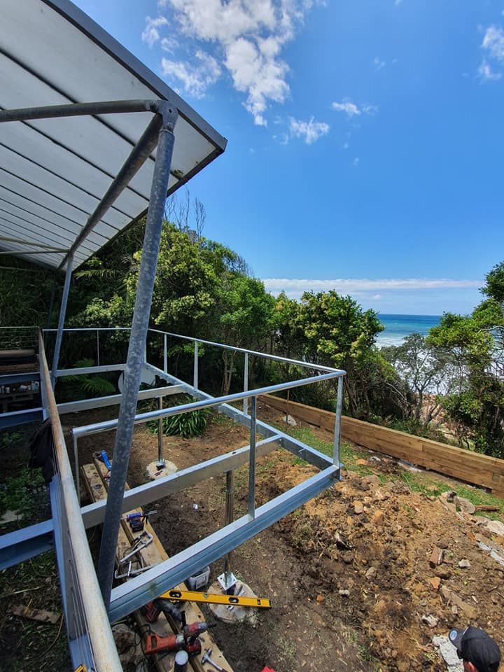 A Metal Structure is Being Built on a Hill Overlooking the Ocean — Proweld Steel Fabrication In Nowra, NSW
