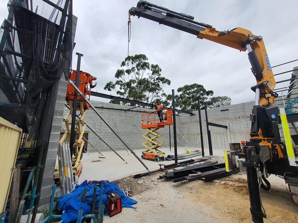 A Construction Workers Use a Crane and Lift — Proweld Steel Fabrication In Southern Highlands, NSW