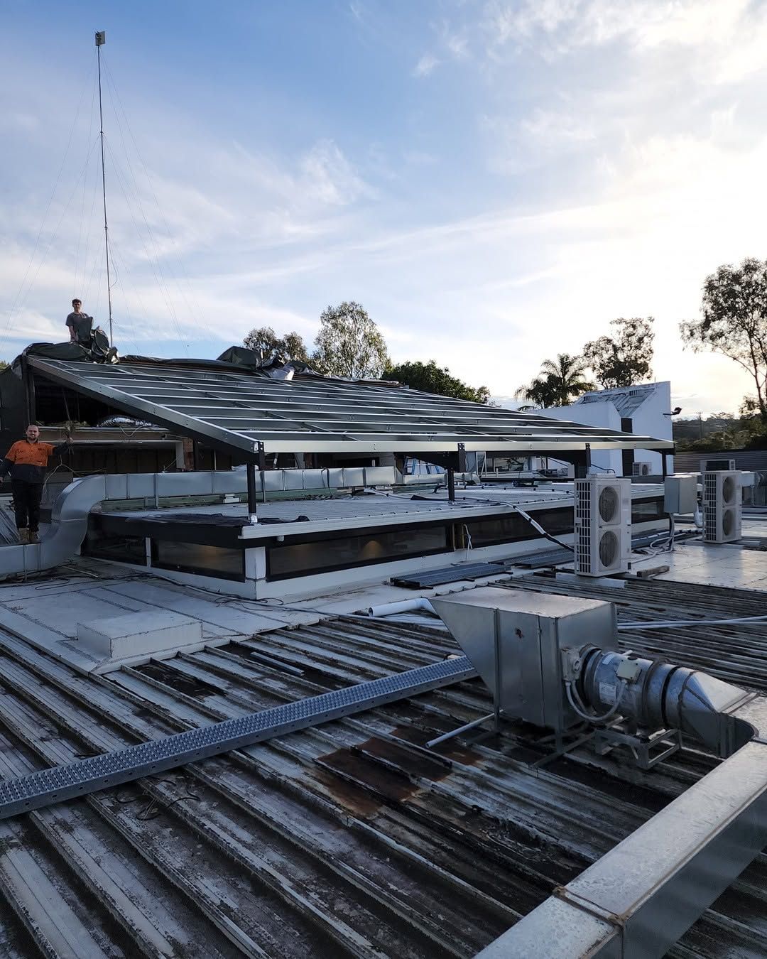 An Open Steel Frame Structure Under a Partly Cloudy Sky — Proweld Steel Fabrication In Unanderra, NSW