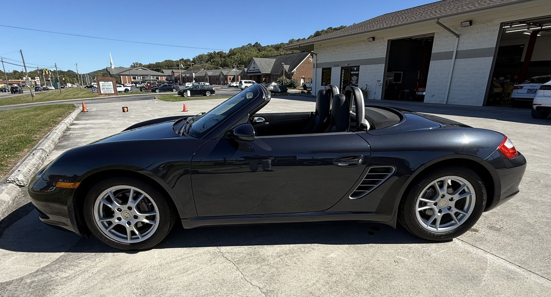 2007 Porsche Boxster Black Convertible Parked Outside Shop | Eurotech Knoxville
