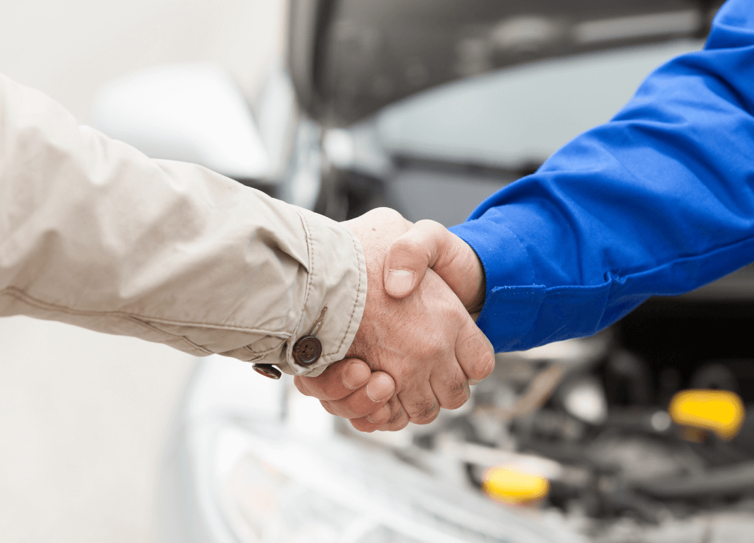 Mechanic shaking hands
