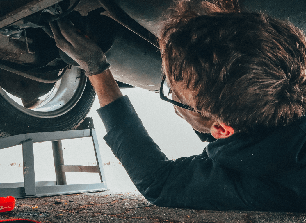 mechanic under the car in augusta