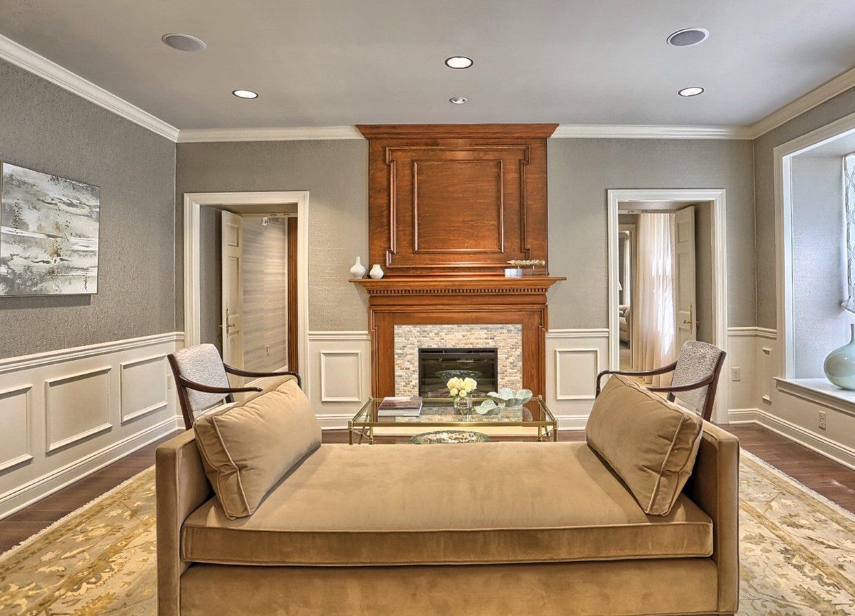 A living room with a couch and a fireplace