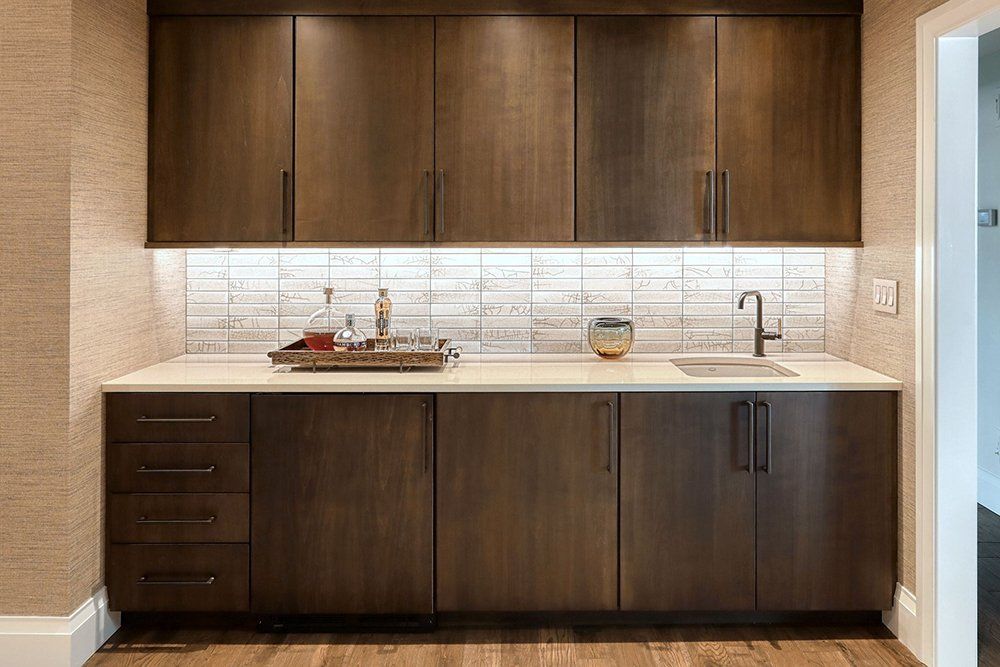 A kitchen with wooden cabinets and a sink