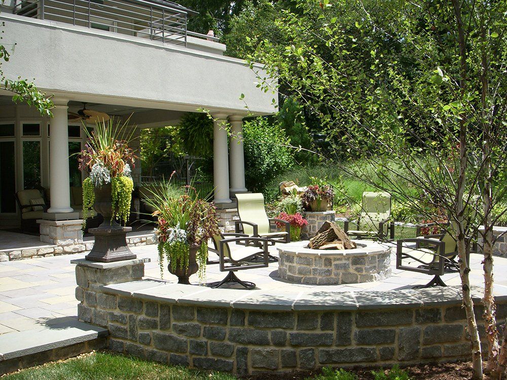 A fire pit sits in the middle of a patio area