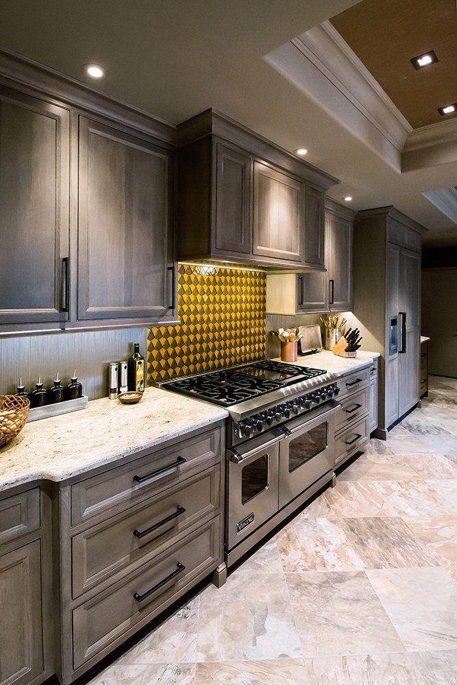 A kitchen with stainless steel appliances and granite counter tops