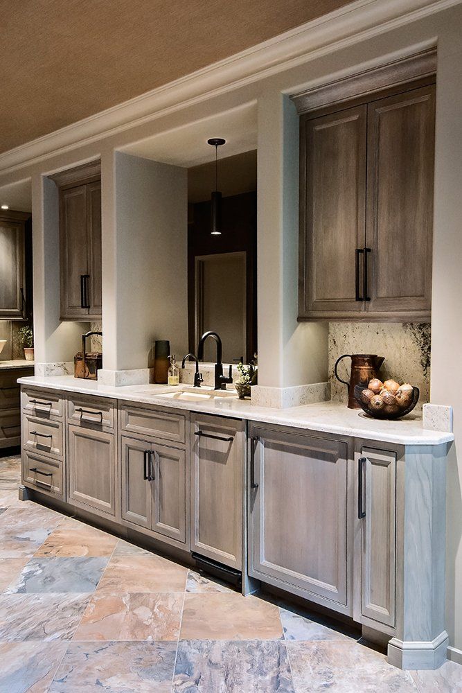 A kitchen with lots of cabinets and a sink