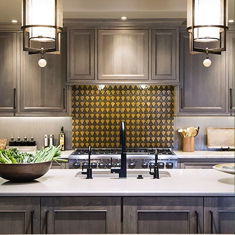 A kitchen with a bowl of vegetables on the counter