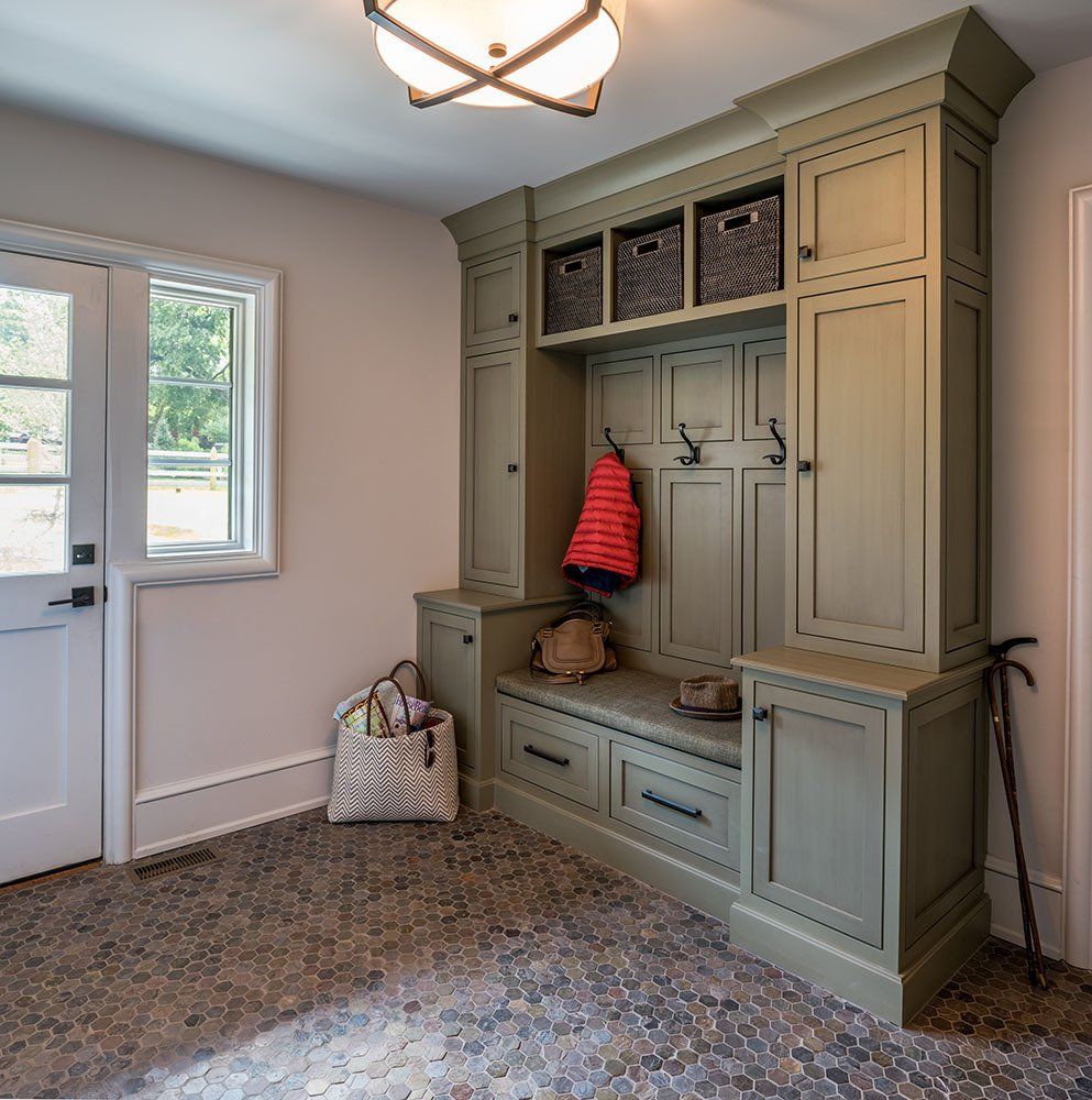 A room with lots of cabinets and a window