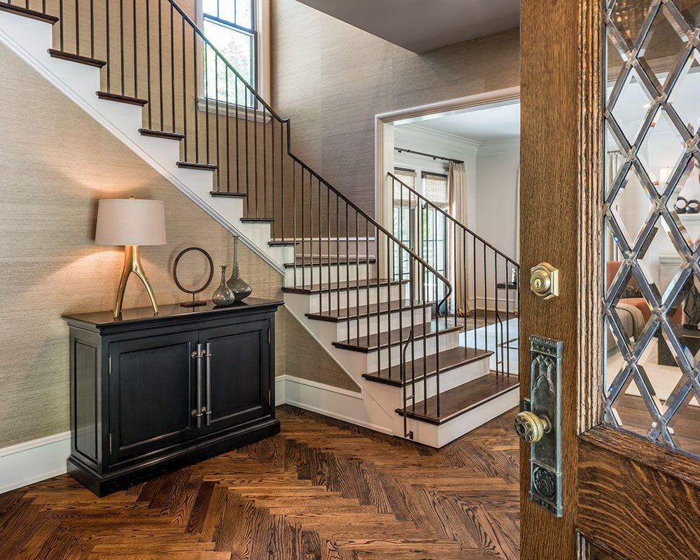 A staircase in a house with a glass door