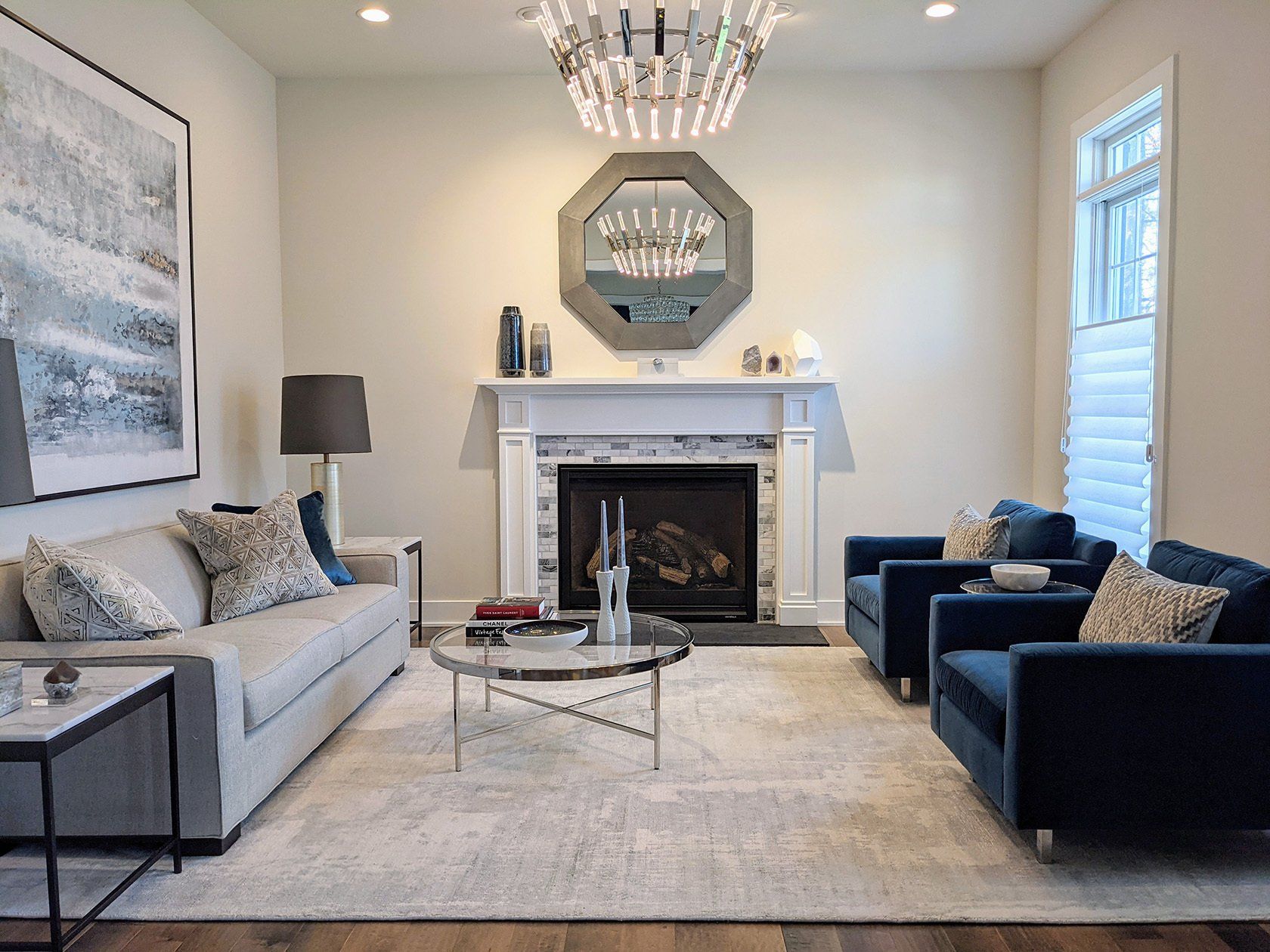 A living room with a fireplace couch and chairs