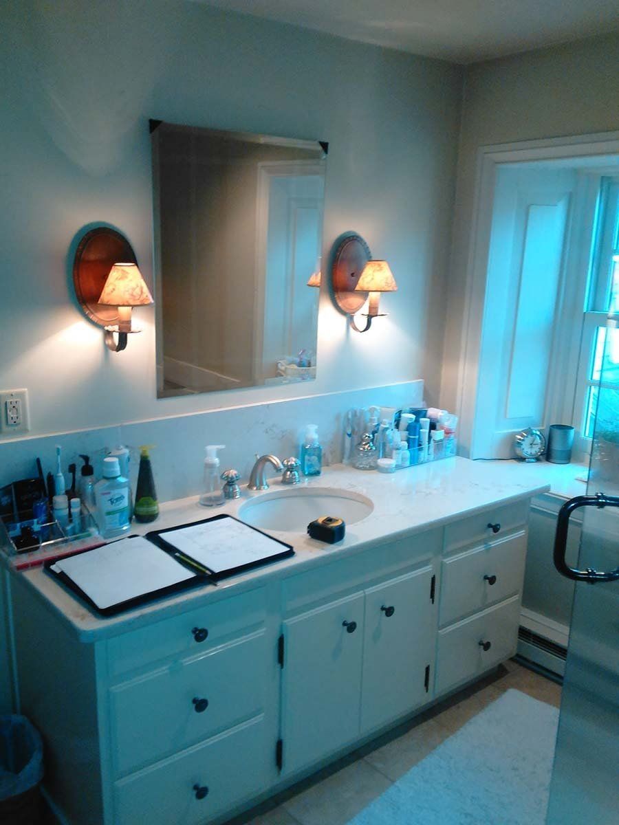 A bathroom with two sinks and two mirrors