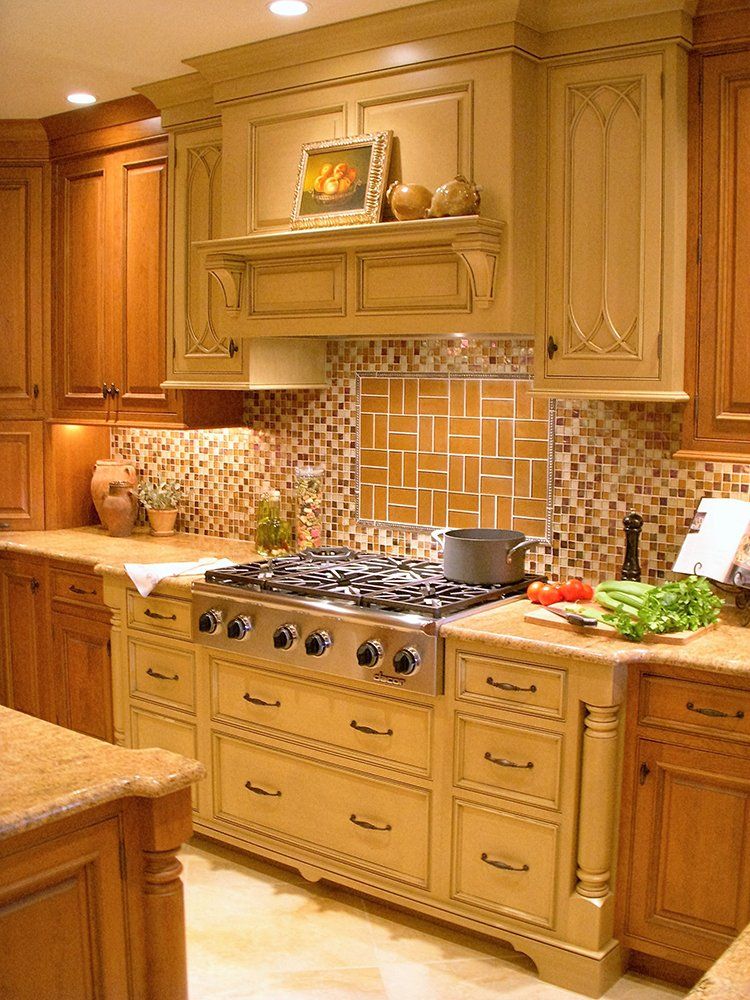 A kitchen with wooden cabinets and a stove top oven
