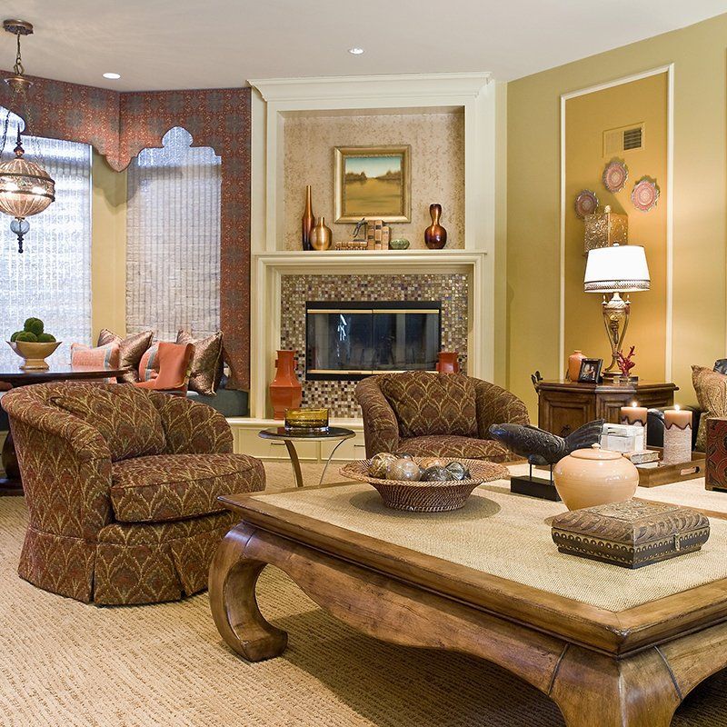 A living room with a fireplace and a coffee table