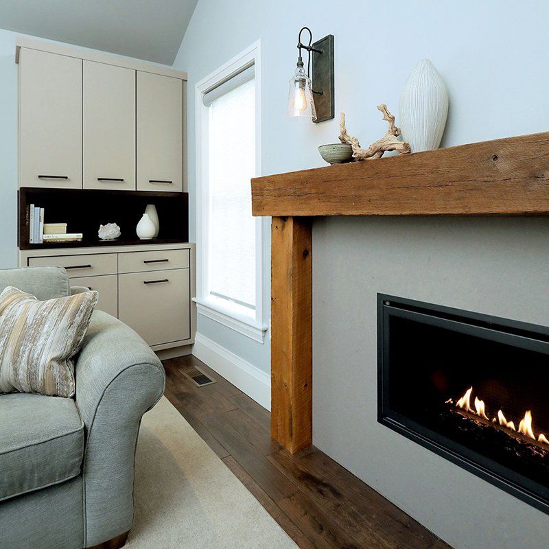 A living room with a fireplace and a couch