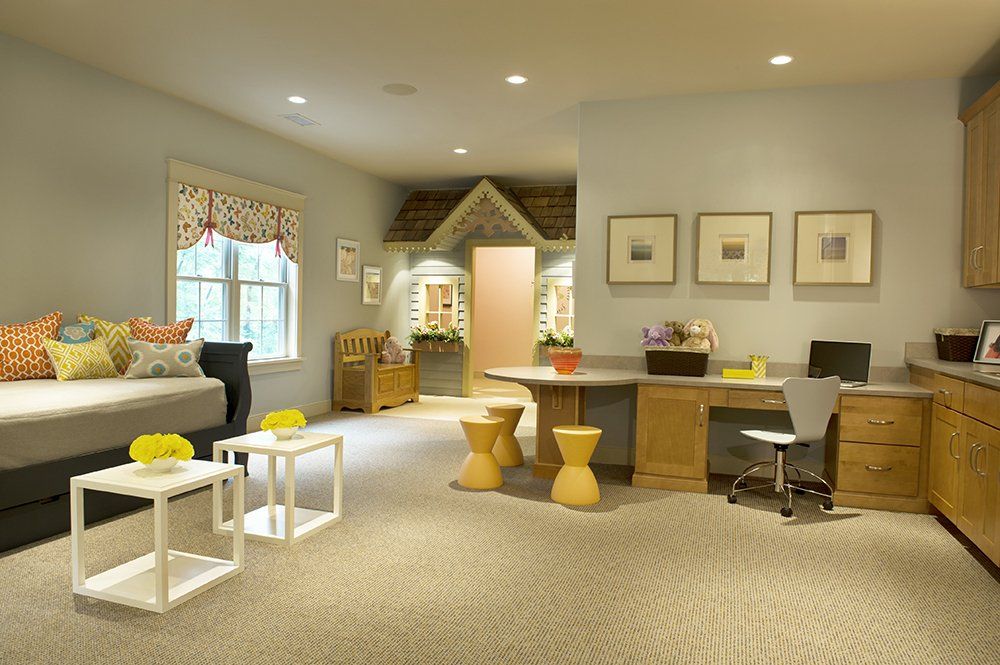 A living room with a playhouse in the corner