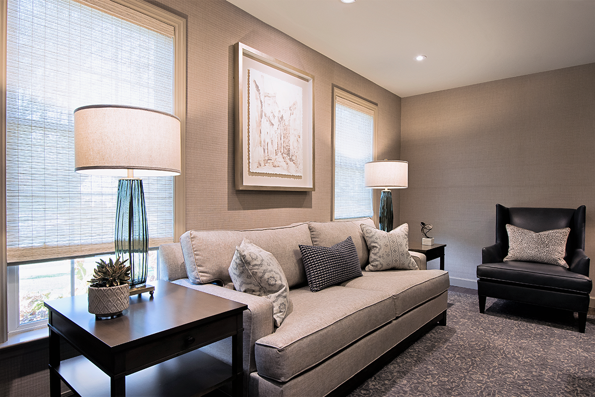 A living room with a couch and a chair