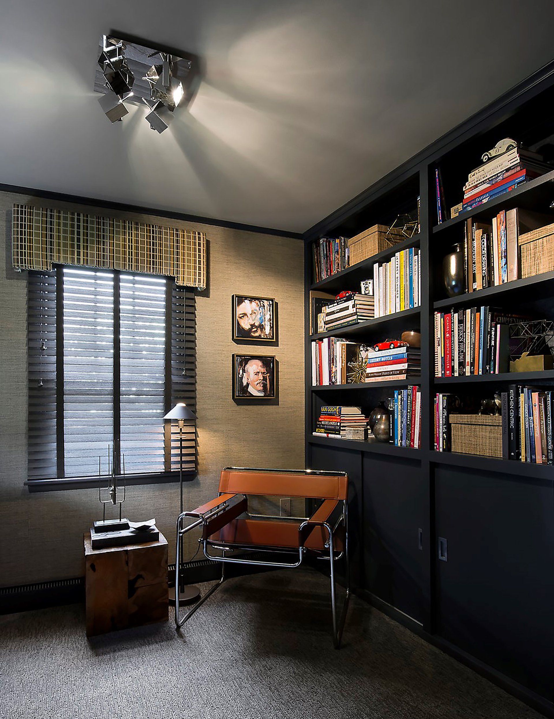 A room with lots of bookshelves and a chair