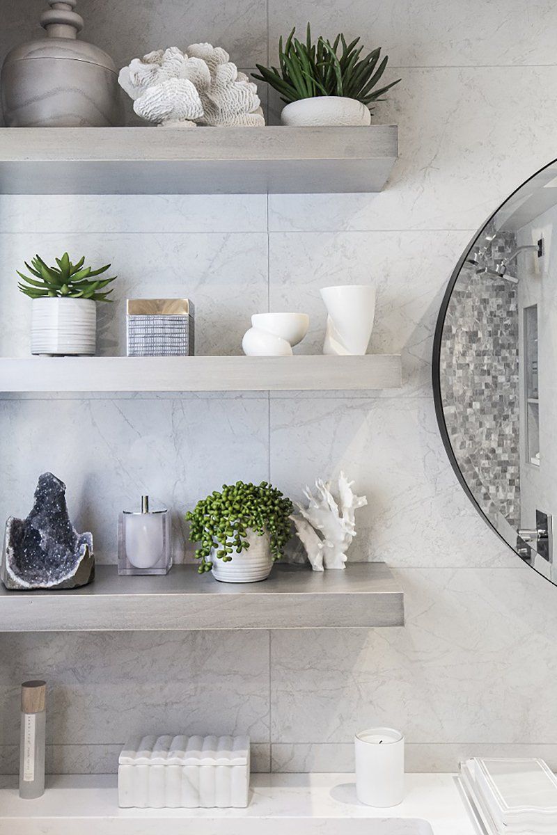 A bathroom with a sink , shelves , and a mirror
