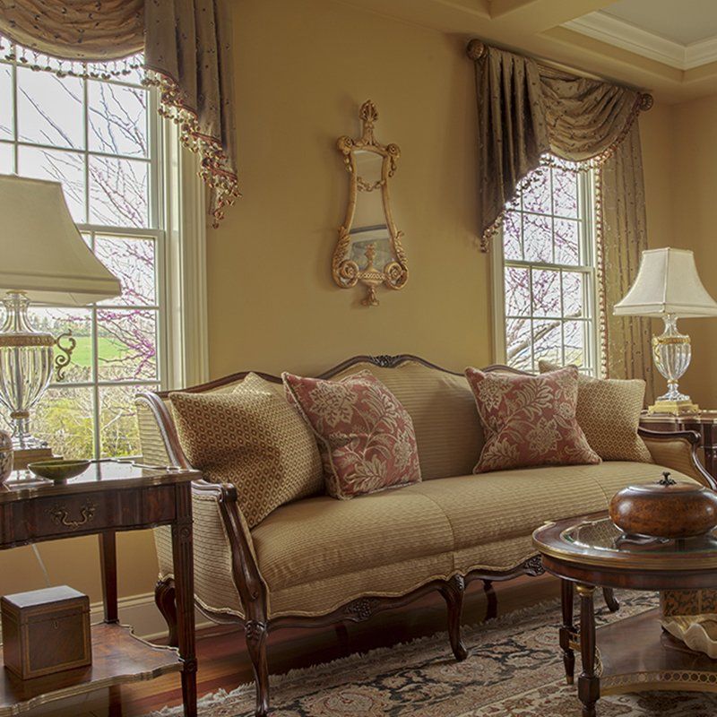 A living room with a couch and two lamps