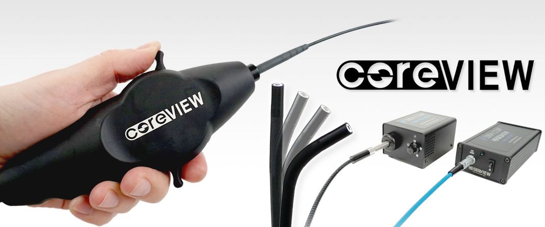 A person is holding a device that says coreview on it