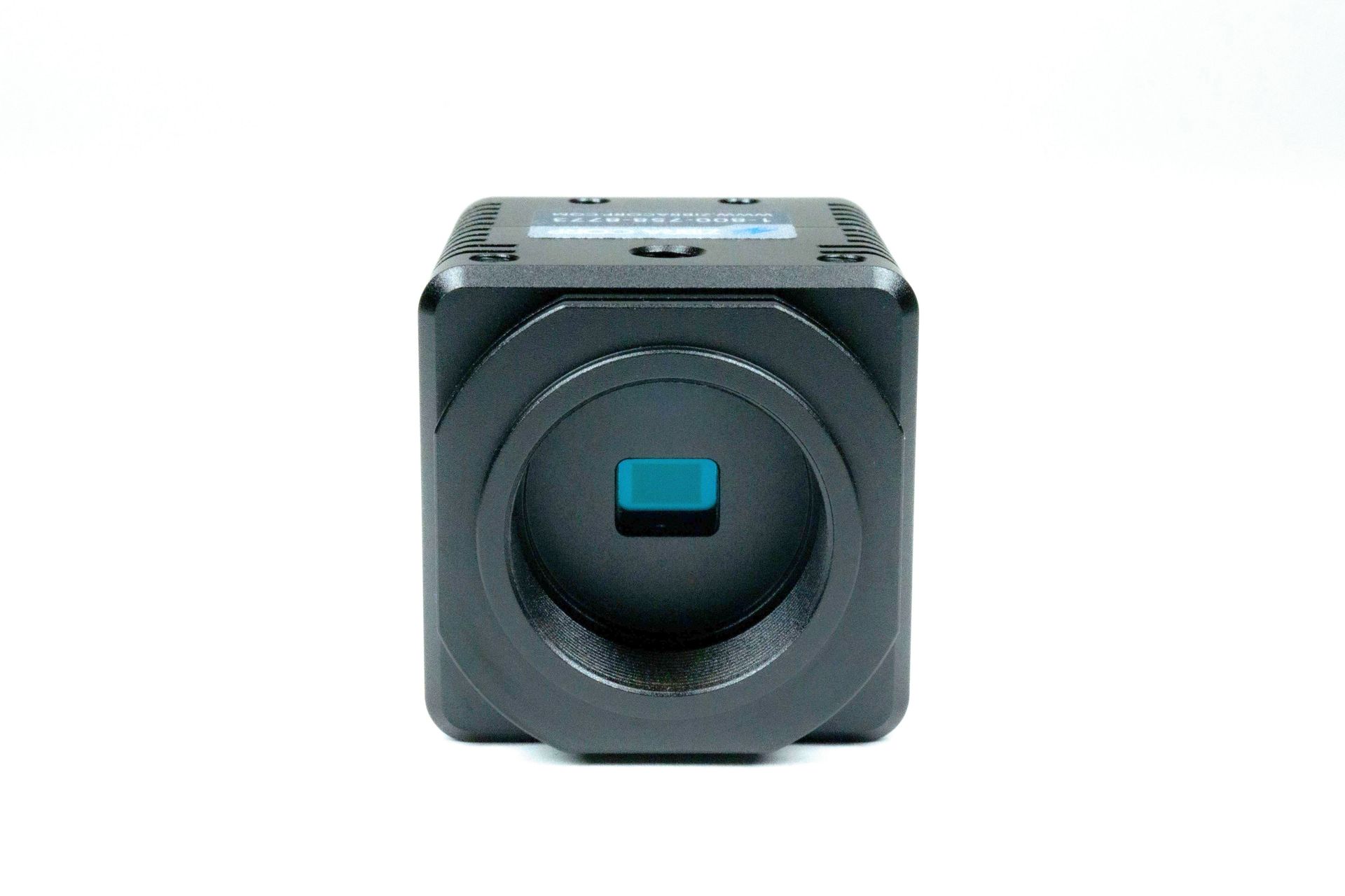 A small black camera with a blue lens on a white background