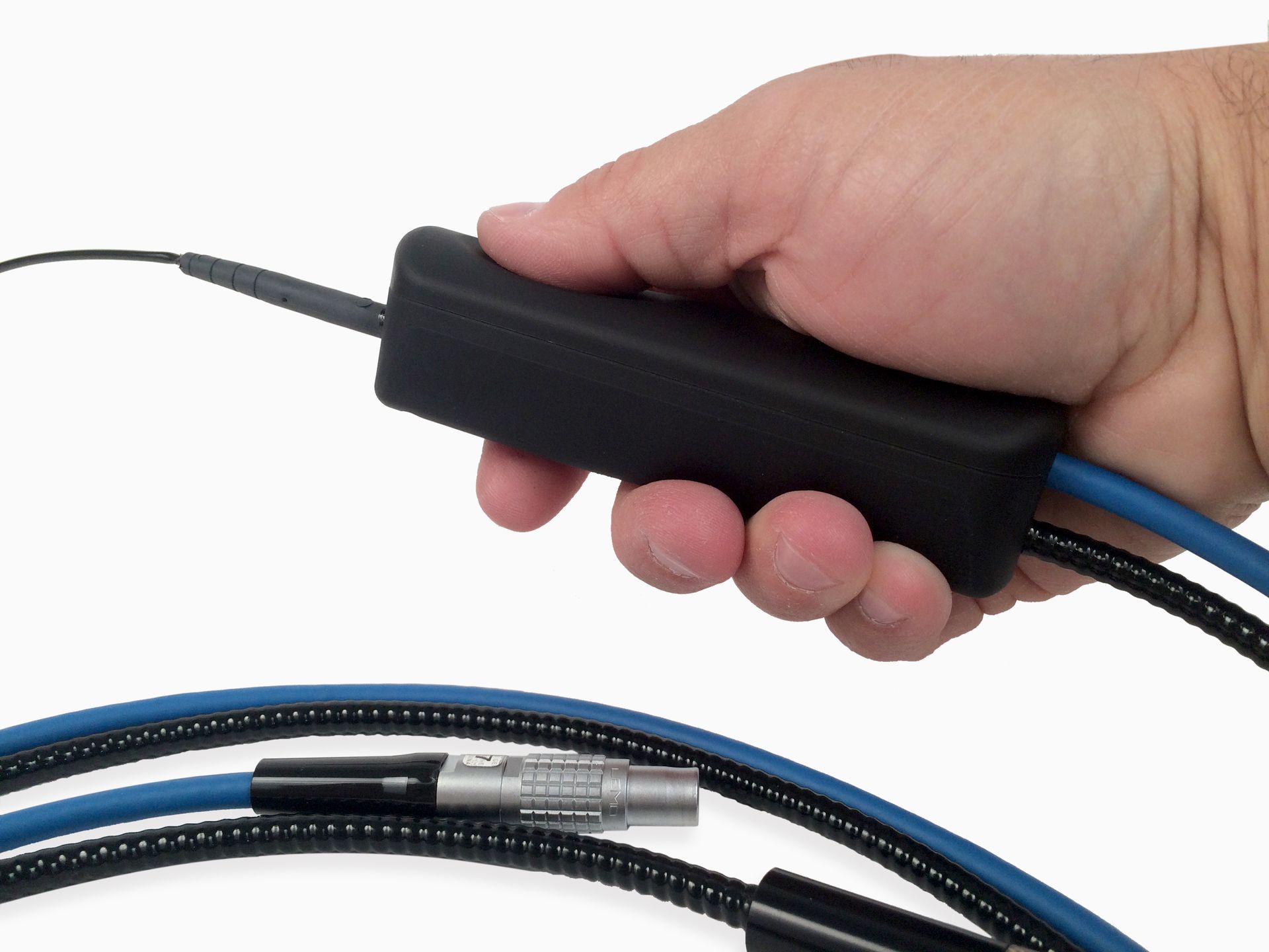 A hand is holding a cable with a black handle