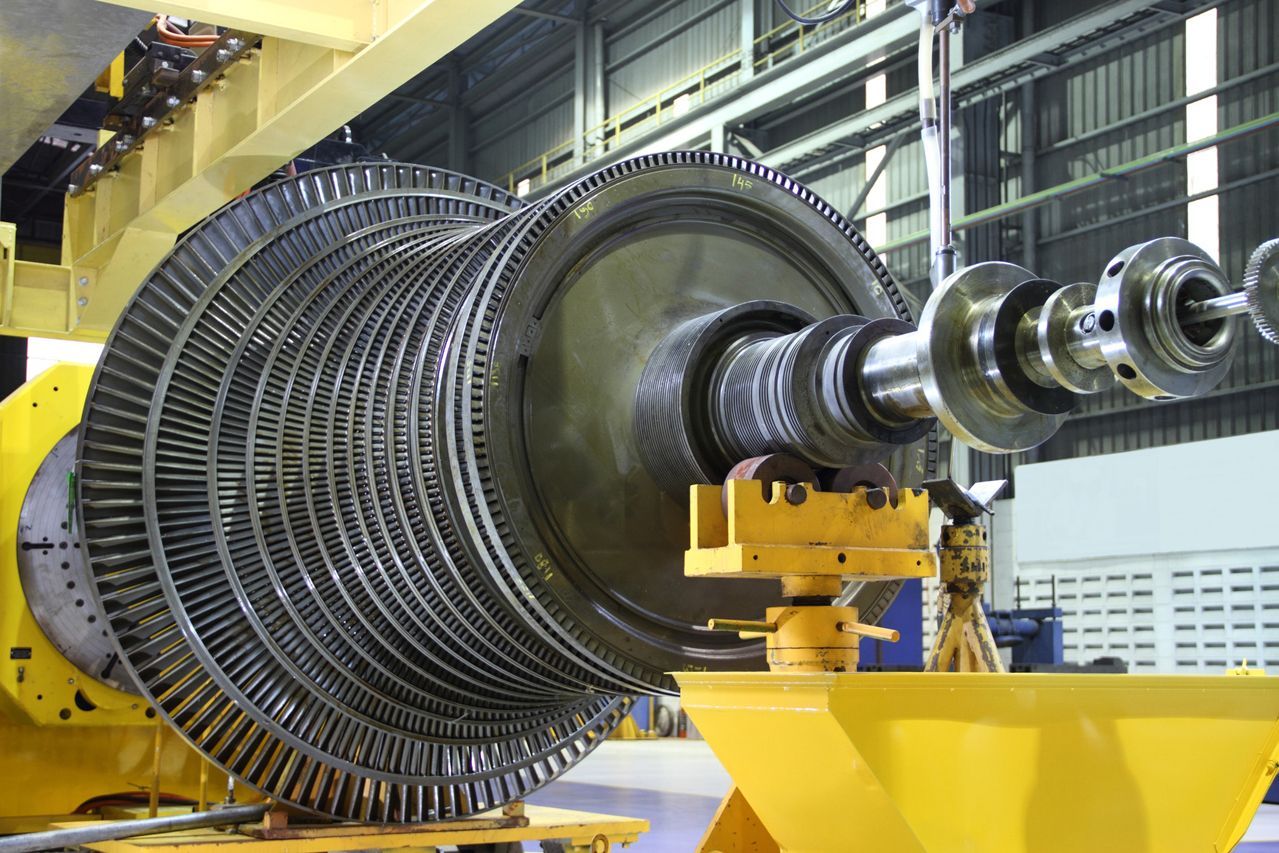 A large turbine is being built in a factory