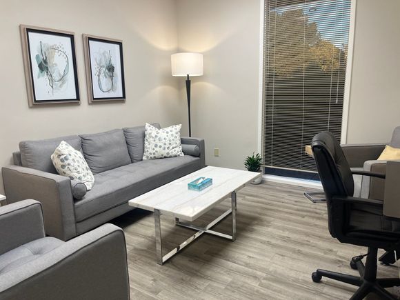 Therapy room with a couch and two chairs