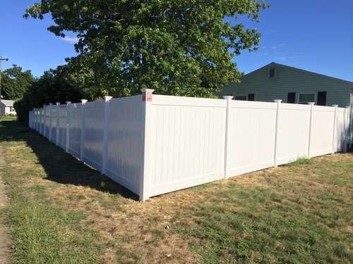 Vinyl Fence with Tree at Side  — Fences in Springfield, MA