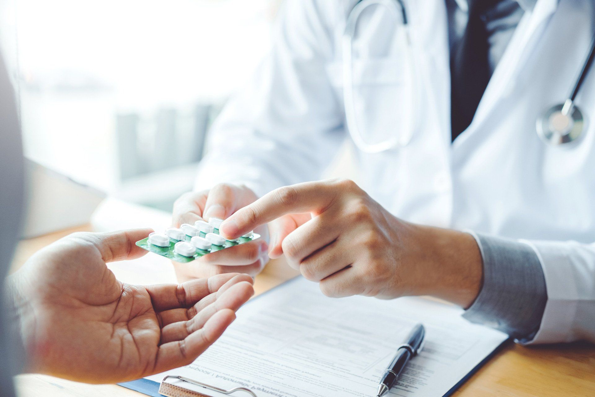 Pharmacist Holding a Medicine — Foley, Alabama — Insurance Specialist