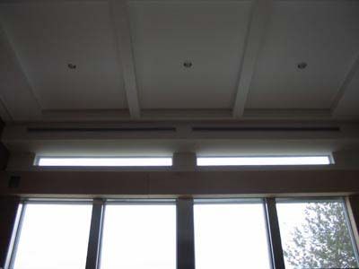 A room with a lot of windows and a ceiling.