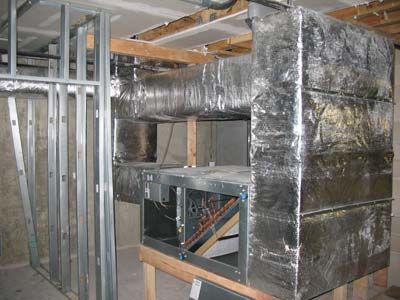 A room with a lot of ducts coming out of it.
