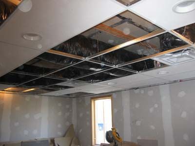 A room with a ceiling that is being remodeled.
