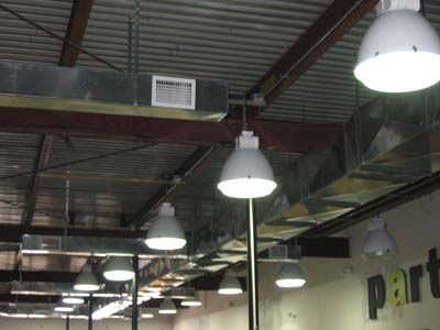 A ceiling with a lot of lights hanging from it