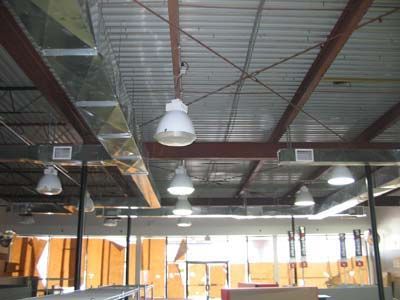 A ceiling with a lot of lights hanging from it