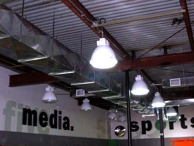 A ceiling with a sign that says media and sports