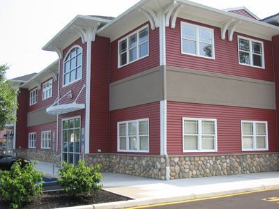 A large red building with a lot of windows