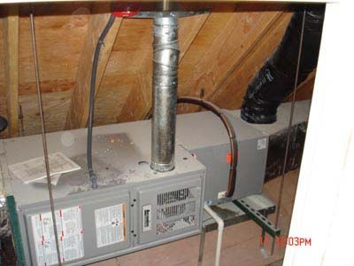 An air conditioner is hanging from the ceiling of a house.